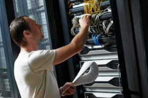 man-maintaining-network-server